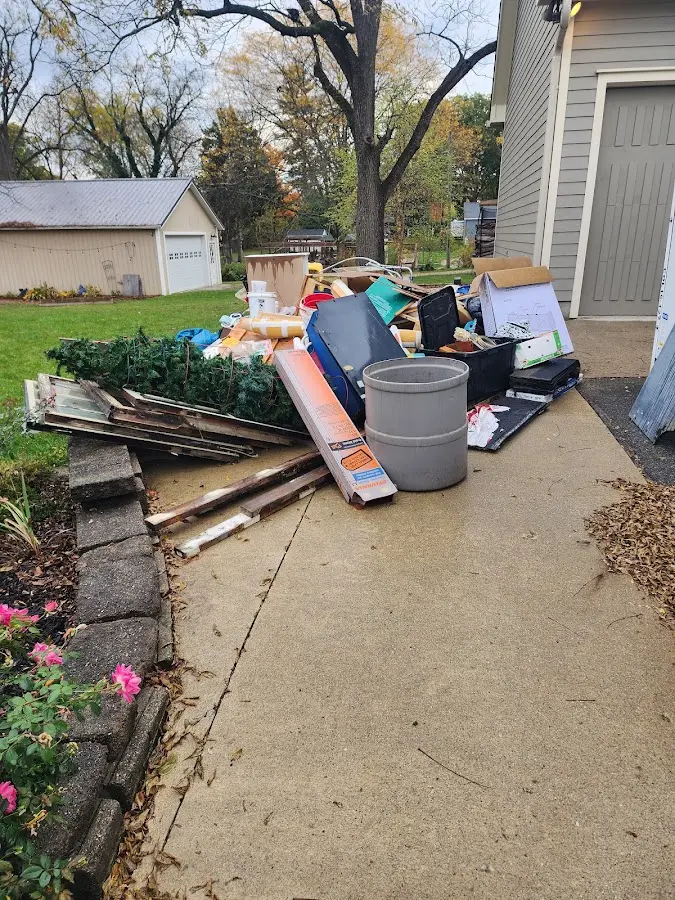 Dumpster being loaded with debris for Commercial Dumpster Rental in Ligonier